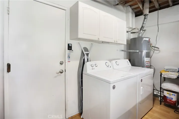 The laundry area is right outside the kitchen door in the garage. The washer and dryer can also stay with the property.