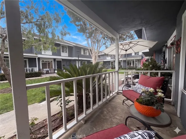 Charming front porch with interior courtyard view