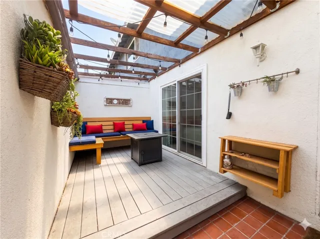 Fire pit is included to enjoy cozy nights. Partially covered by sheer roof in laundry area.