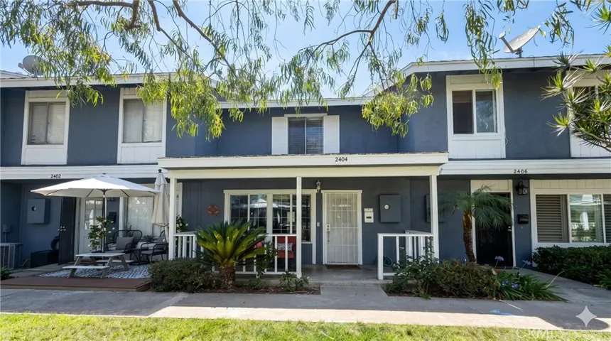 Charming front porch overlooking the courtyard - a gathering place for neighbors