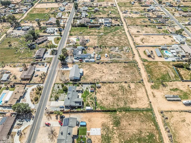 Aerial view of the block illustrating the expansive 1-acre properties and quiet desert surroundings.