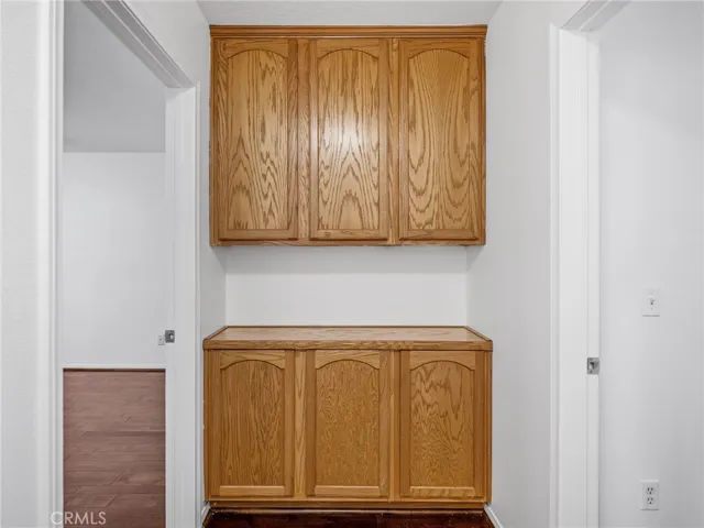 Enjoy added organization with a built-in wood linen cabinet — perfect for towels and essentials.