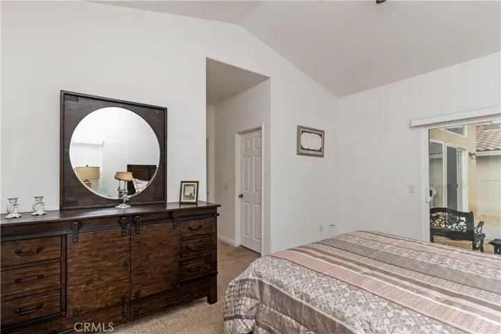 Primary Bedroom With Vaulted Ceiling & Patio Access