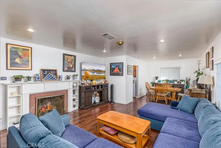 Living room has a two-sided fireplace with built-in shelves.