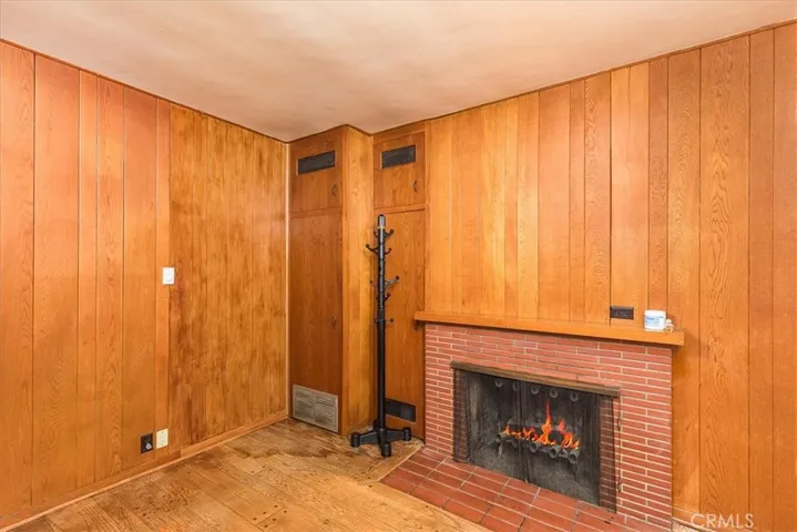 Den showing the two-sided fireplace