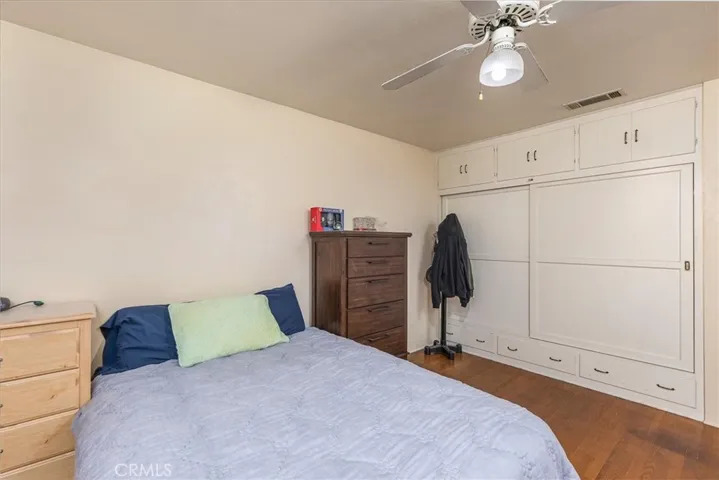 Another view of the middle bedroom with closet and storage