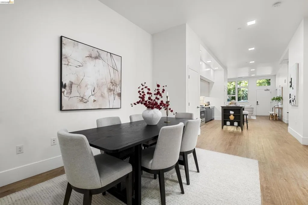 Dining space featuring light wood-style flooring and recessed lighting