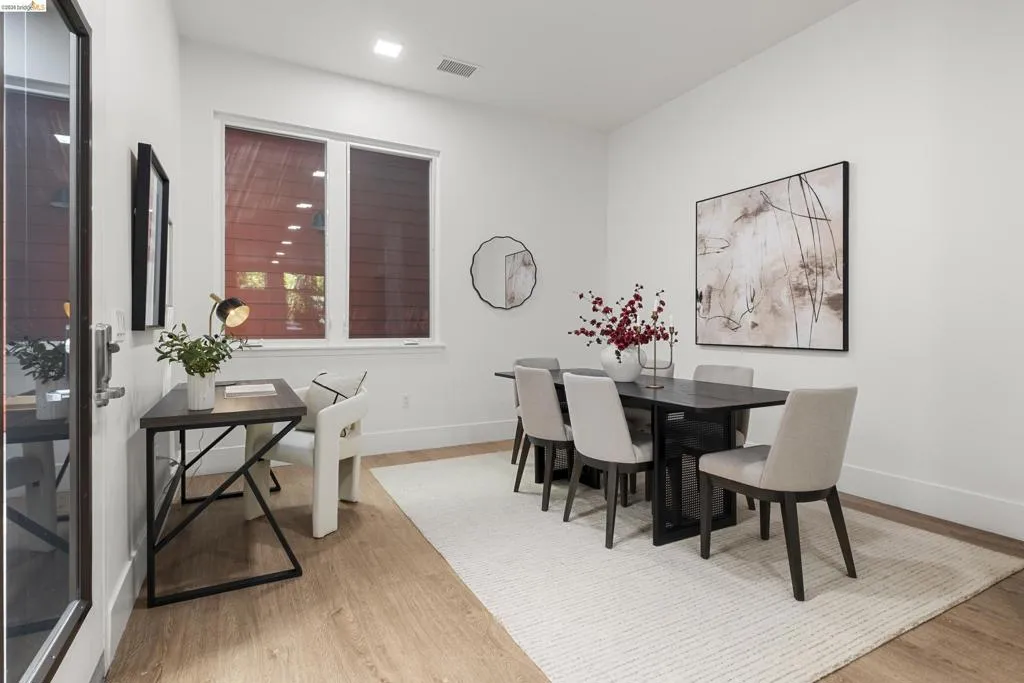 Dining area with light wood finished floors