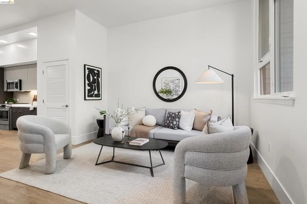 Living area with light wood-type flooring and baseboards