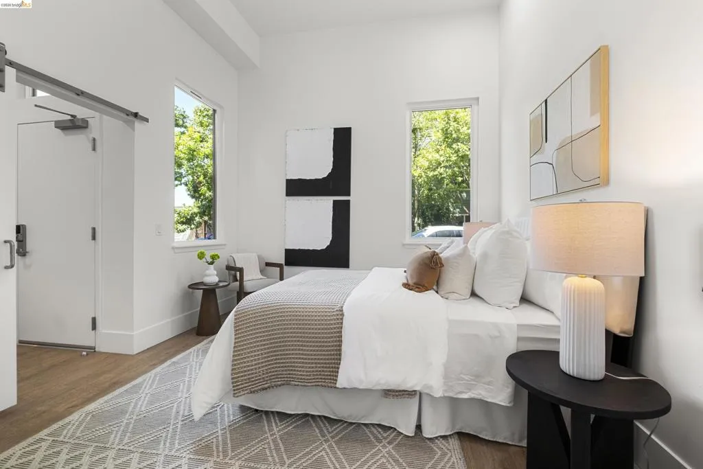 Bedroom featuring wood finished floors and baseboards