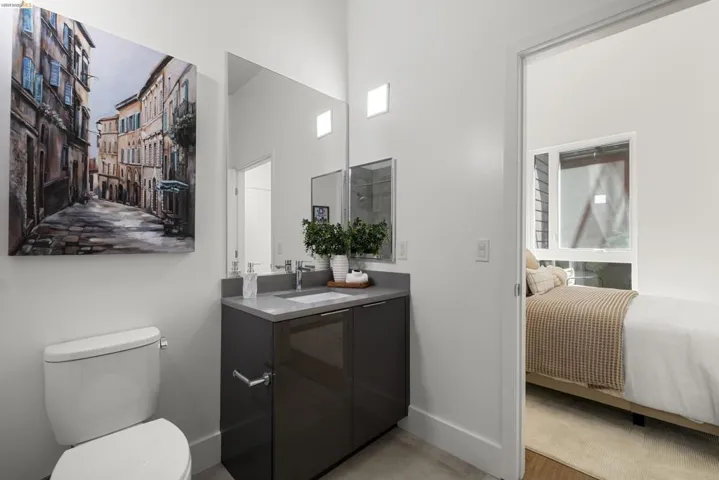 Ensuite bathroom featuring vanity and toilet