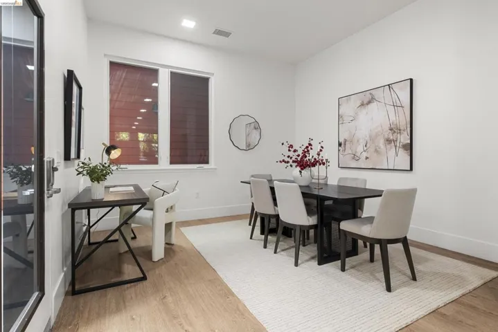 Dining area with light wood finished floors