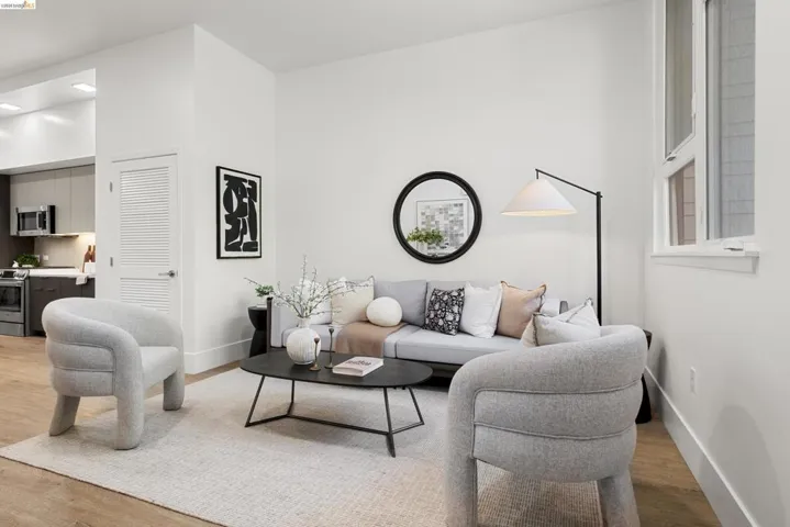 Living area with light wood-type flooring and baseboards