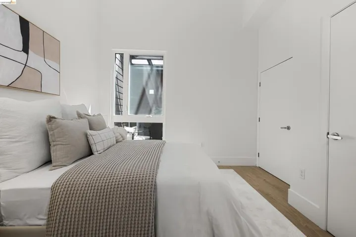 Bedroom featuring light wood-style floors and baseboards