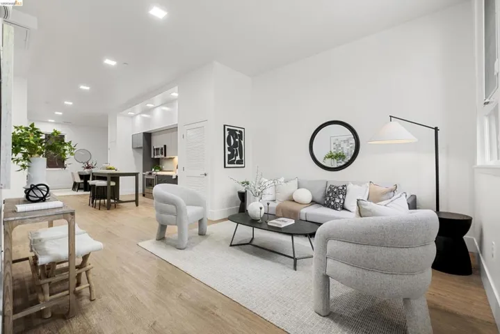 Living room with light wood-style floors and recessed lighting