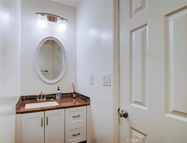 Vanity and mirror in second bath