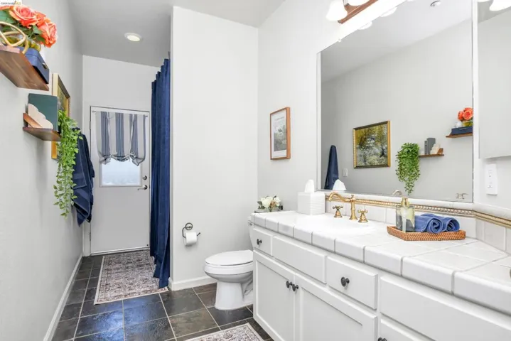 Bathroom with vanity and a shower with curtain