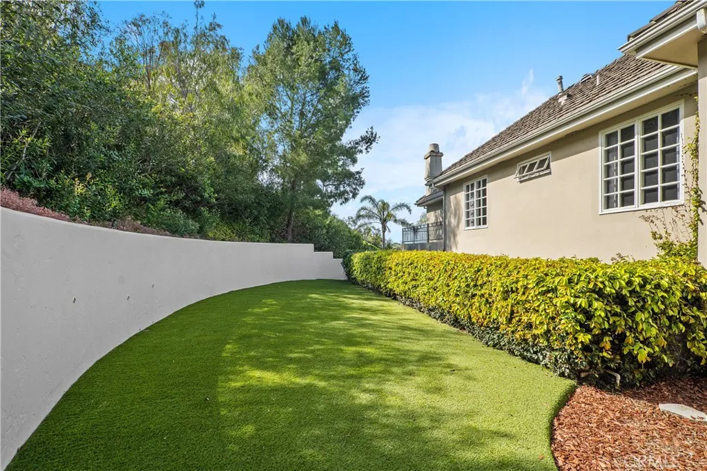 Newly turfed side area right off the bonus room that wraps to the back yard!