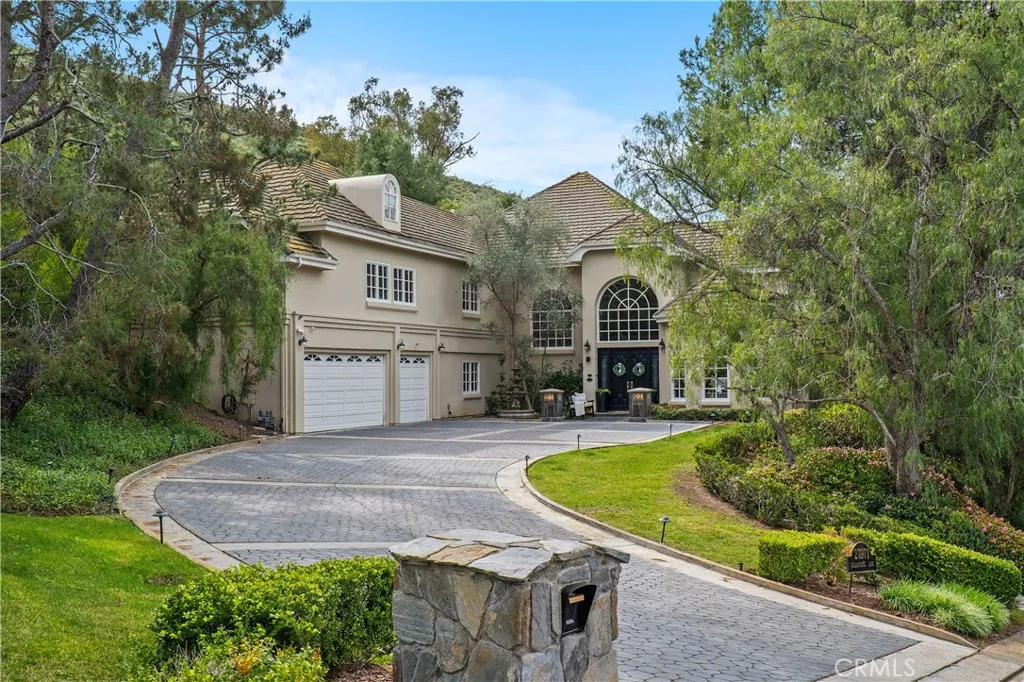 Tucked away in the Hunt Club for added privacy sits a French inspired chateau - 27971 Golden Ridge!
