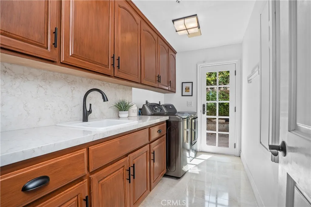 Remodeled with new countertops in quartz and a laundry shoot!