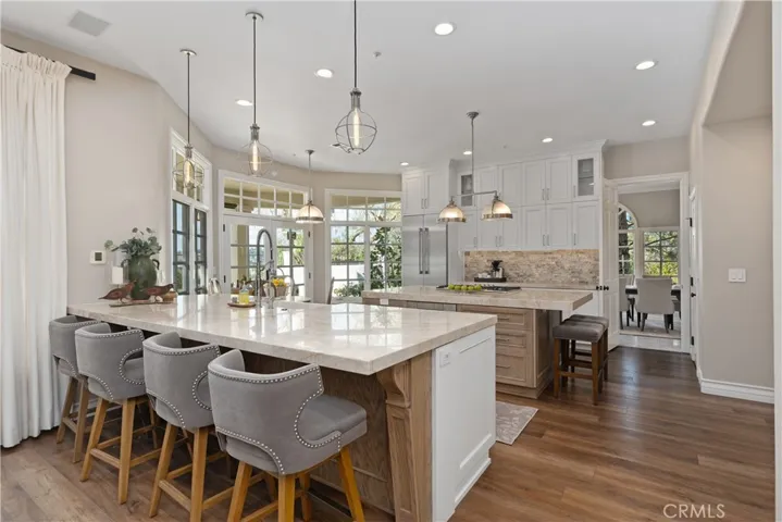 Remodeled Kitchen in white cabinetry and french oak wood