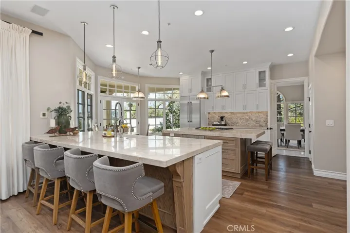 Remodeled Kitchen in white cabinetry and french oak wood