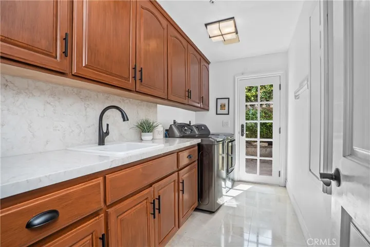Remodeled with new countertops in quartz and a laundry shoot!