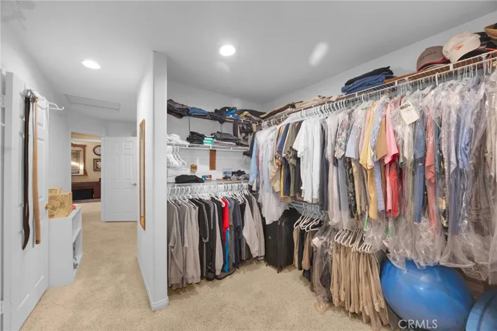 Just one view of the dual his & hers walk-in closets