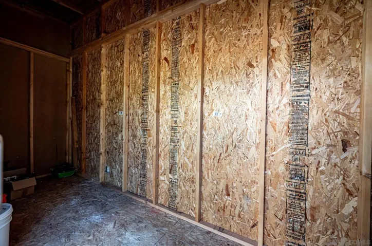 Inside bonus building #3, storage shed attached to North side of home