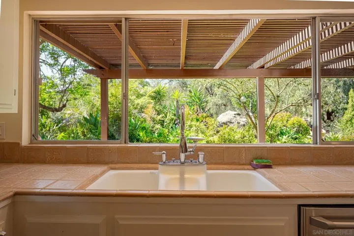 Kitchen sink/window view to backyard