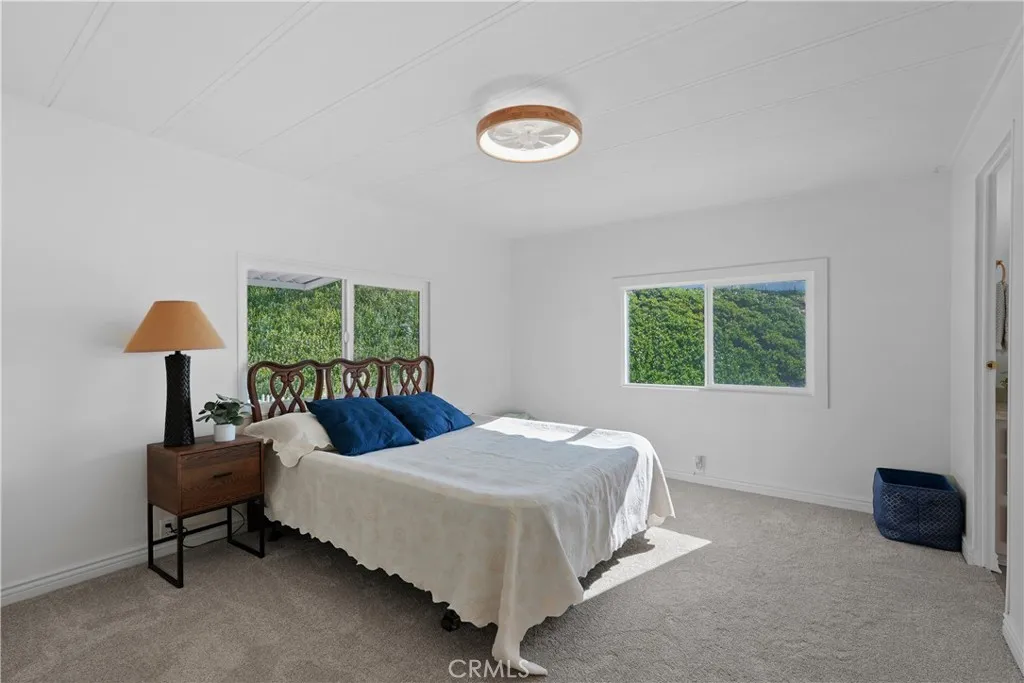 Primary bedroom with 2 bright windows