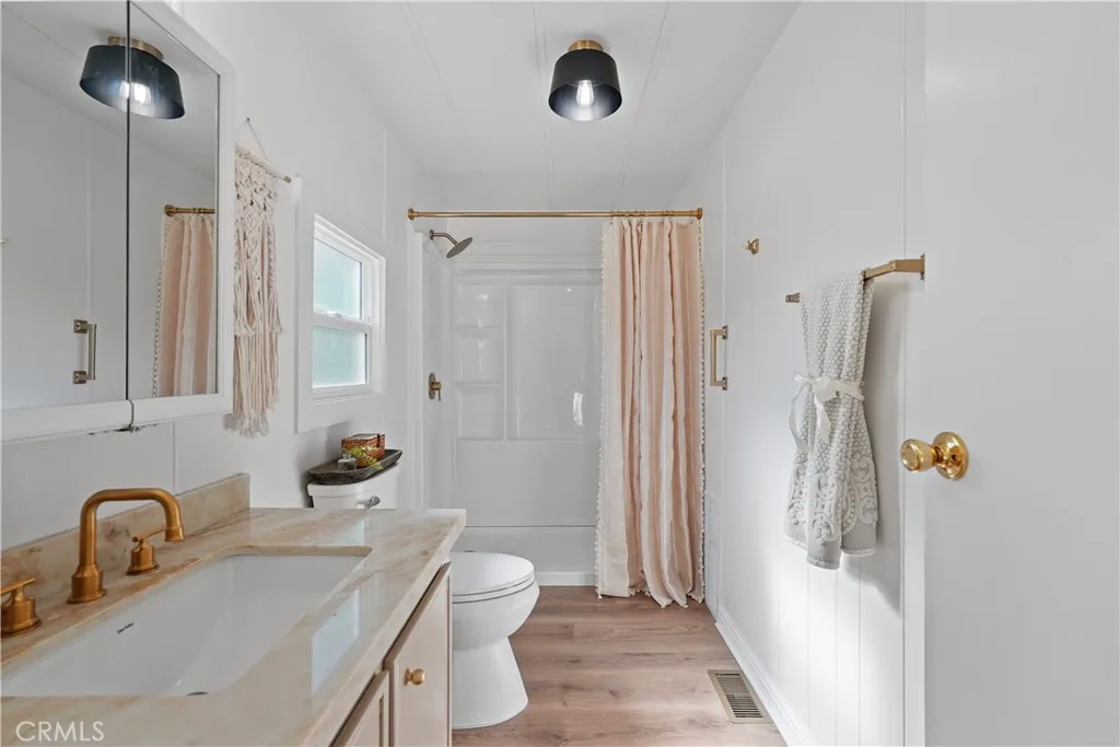 Remodeled primary bathroom- new shower, new quartz counters, new paint, new faucet, new lighting, new larger window was installed, new floors....