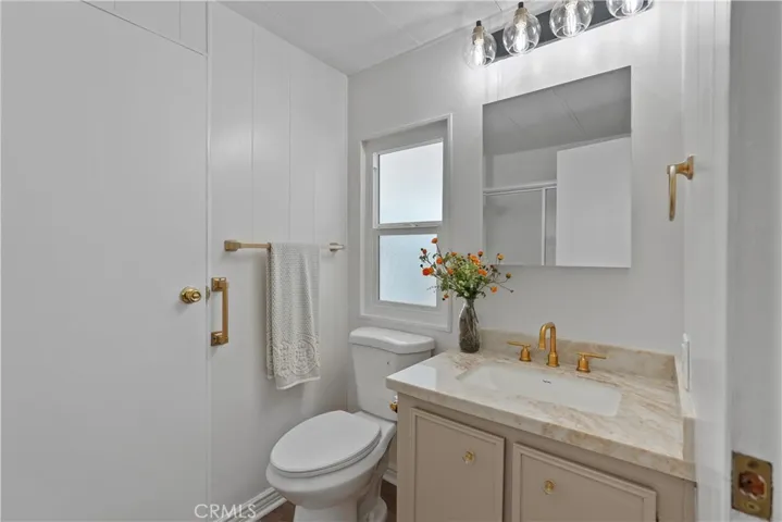 Bathroom 2 has new lighting, new quartz counters, new faucet, new toilet, new paint and flooring!