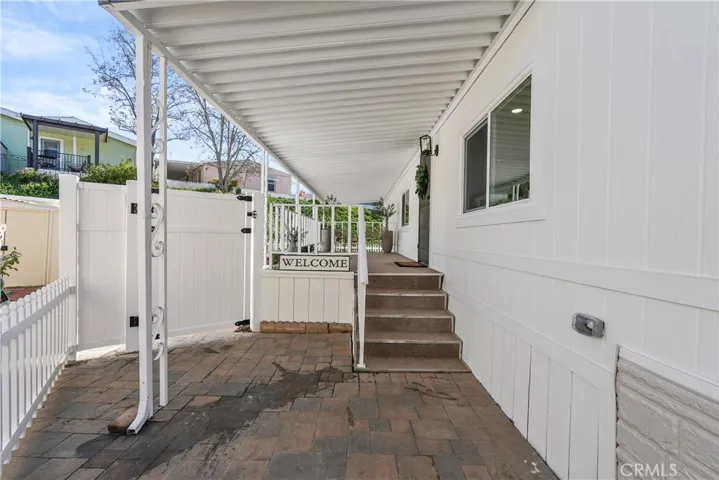 Front approach to home- to front door and to enclosed side yard