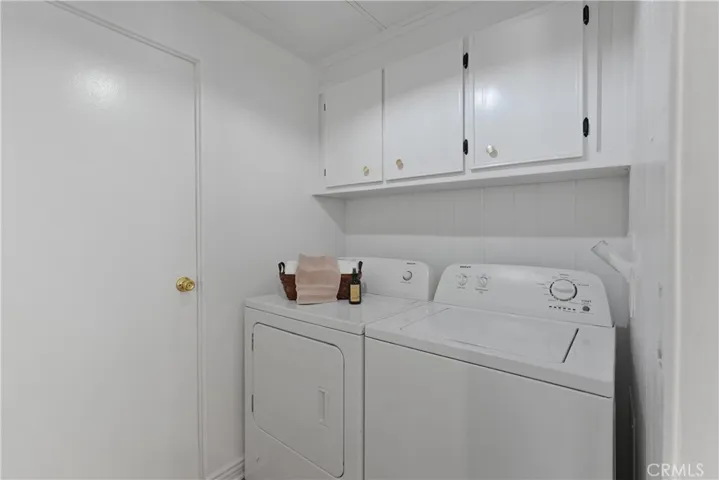 Laundry room has cabinets and great storage (washer and dryer do not stay)