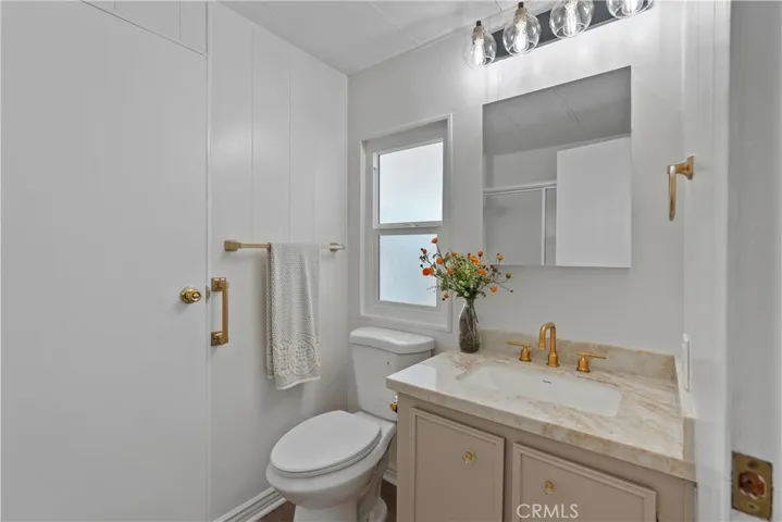 Bathroom 2 has new lighting, new quartz counters, new faucet, new toilet, new paint and flooring!