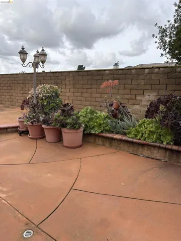 Fenced backyard with a patio area