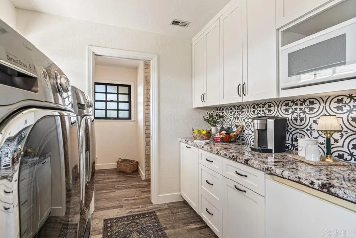 Laundry room and second bath on lower level