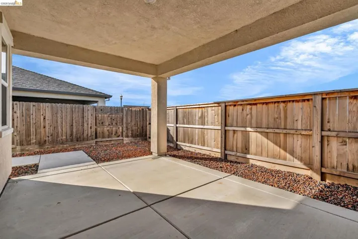 Fenced backyard featuring a patio area