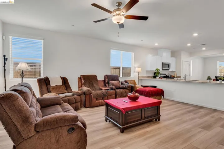 Living area featuring light wood-type flooring, recessed lighting, and ceiling fan
