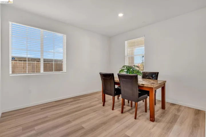 Dining room with light wood-style floors and baseboards