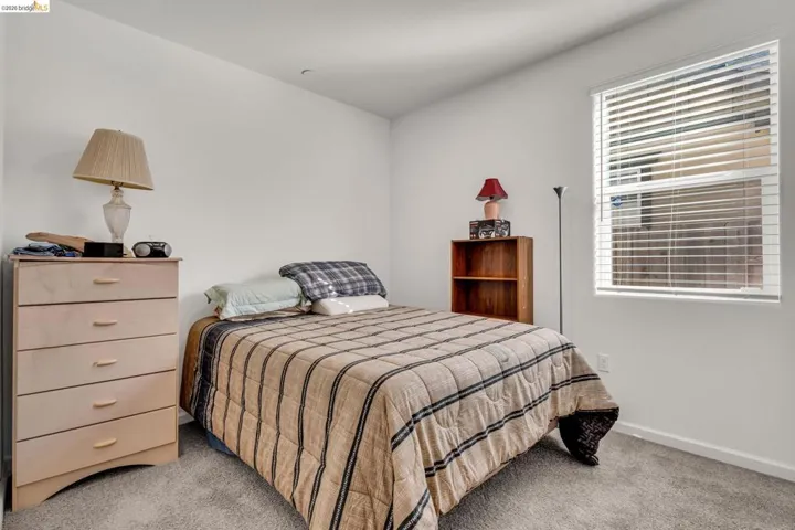 Bedroom with light carpet
