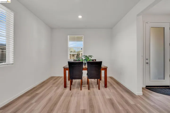 Dining area featuring light wood finished floors and recessed lighting