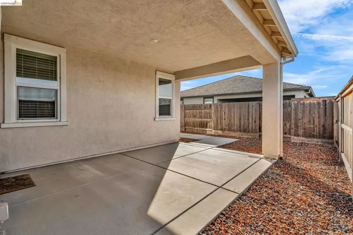Fenced backyard featuring a patio area