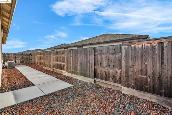 View of fenced backyard