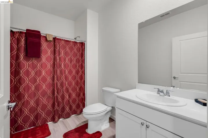 Full bath featuring vanity and light wood finished floors