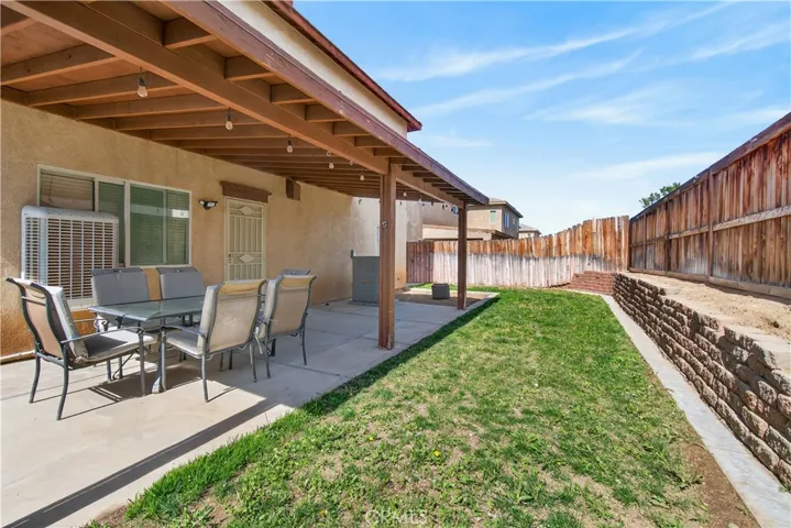 Backyard with patio cover.