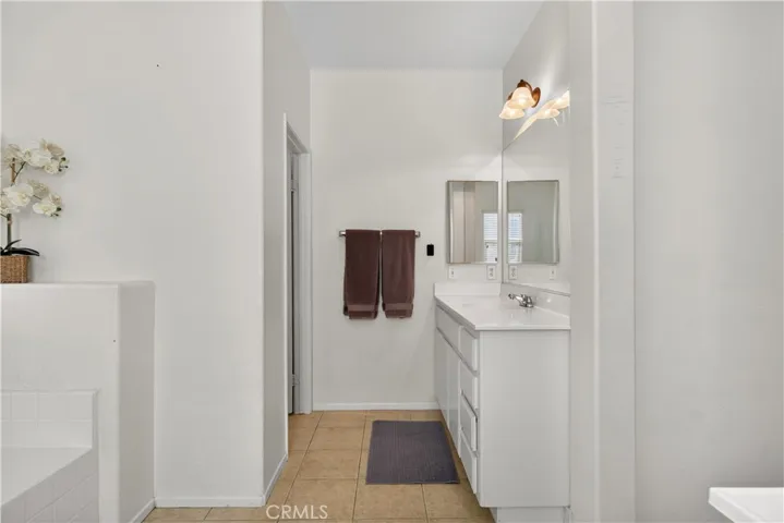 Bathroom #2: Opposite side: Spacious master bathroom featuring dual vanities.