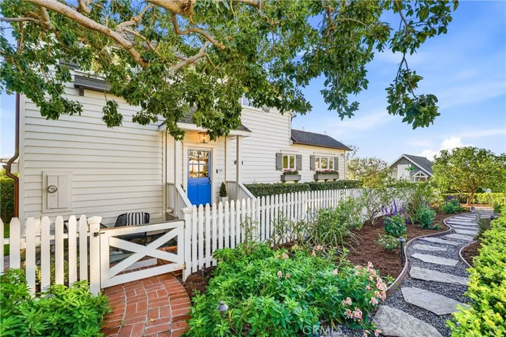 Beautiful front garden with mature lemon tree anchoring the garden.