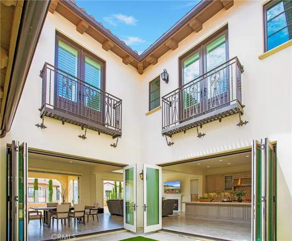 Internal courtyard access through bifold doors off kitchen and dining spaces